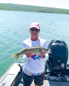 Stacey is a remote worker who is able to enjoy fishing in her free time. 